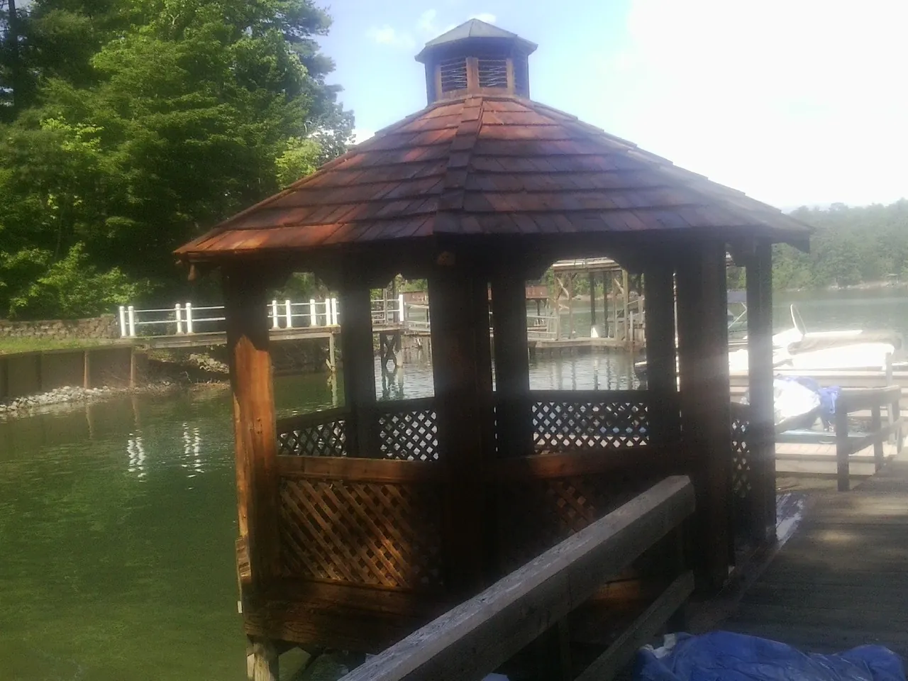 Cedar shake gazebo roof rebuilt on a lake dock in Peckville